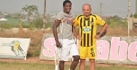 Injured Evans Quao with Coach