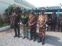 Officers of Yendi Prison in a photo with Crime Check Foundation representative