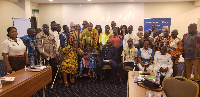 Samuel Ofosu Ampofo in a photo with some PWDs at the retreat