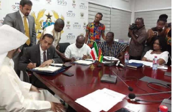 Finance Minister, Ken Ofori-Atta signing the deal with the delegates fro Kuwait