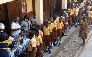 Children line up to be served their meals | File photo