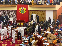 Military men moving to the floor of parliament