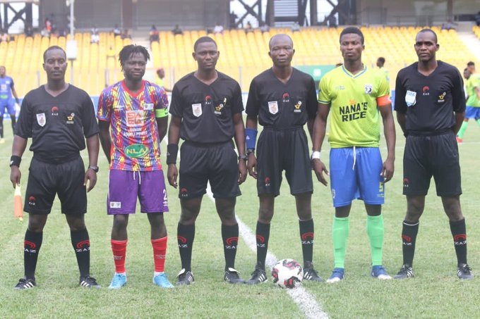 Skippers of both teams with match officials take a group photo