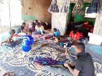 Some children weaving smock