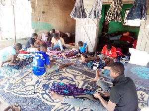 Some children weaving smock