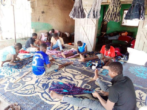 Some children weaving smock