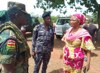 Madam Veronica Alele Heming speaking with some officers