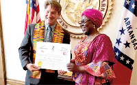 Hajia Alima Mahama receiving the citation from Mark Martin, Arkansas Secretary of State