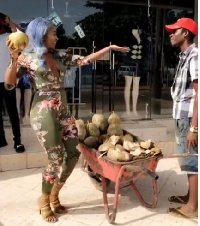 Efia Odo with a coconut seller