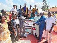 Morro Fuaseni receiving a certificate for emerging as the district's best farmer