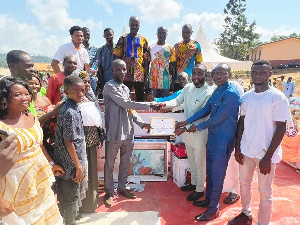 Morro Fuaseni receiving a certificate for emerging as the district's best farmer