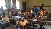 Students in the Ellembele District writing BECE