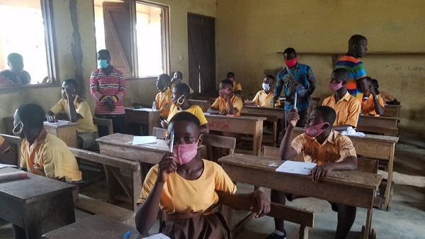 Students in the Ellembele District writing BECE