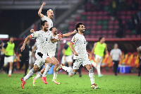 Egyptian players celebrate beating hosts Cameroon