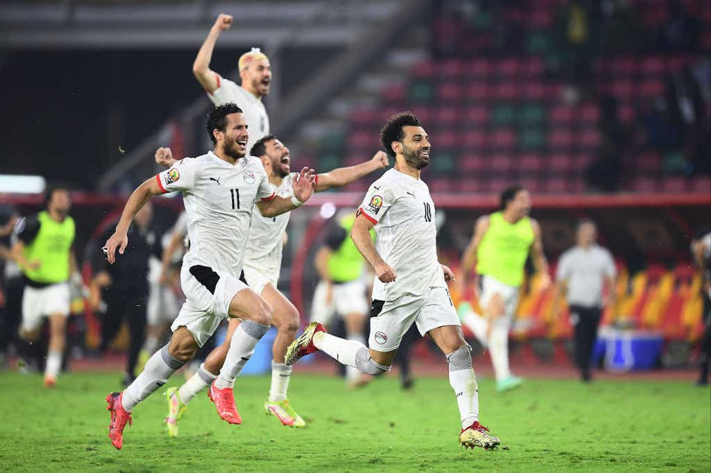 Egyptian players celebrate beating hosts Cameroon