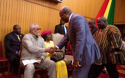 Former President Jerry John Rawlings in a handshake with Ex-President John Mahama