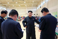 North Korean leader Kim Jong Un visits a farm machine exhibition Photo: Reuters