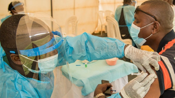 A health worker administers the Covid-19 vaccine at Nyamata District Hospital in Bugesera, Rwanda