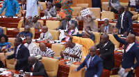 Minority members holding placards with the inscription 