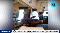 Some of the teachers sitting on the desks