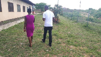 Umaru Sanda walking with the teenage girl