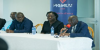 Managing Director of Premium Bank, Mr Kwasi Tumi [microphone in hand]