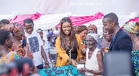 Jackie Appiah with beneficiaries at the Spintex market