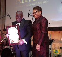 President Akufo-Addo being presented with a Congressional Record by US Congresswoman Karen Ruth Bass