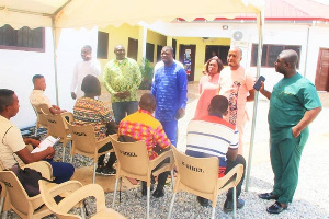 Kofi Baah Agyepong with some beneficiaries