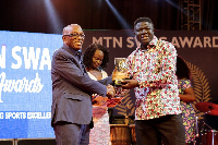 Kofi Addo Agyekum receiving an award