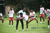 Jordan Daitey taking the players through training