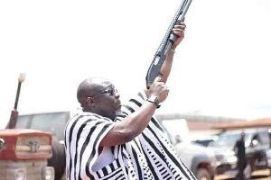 George Andah With A Gun