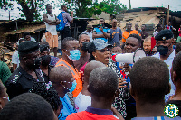 Accra Mayor addresses a cross section of people at the fire scene