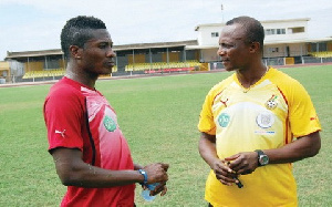 Asamoah Gyan and Coach Kwesi Appiah