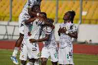 The Black Meteors celebrate a goal