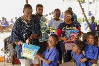 Members of Cuties Readerfeast Foundation with the pupils of Berekuso schools at the event held on We