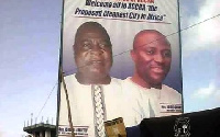 The huge billboard with the portrait of the two officials