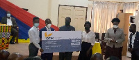 Some of the beneficiaries receiving the cheque