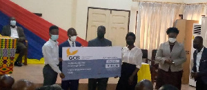 Some of the beneficiaries receiving the cheque