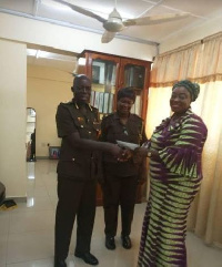 Local Organising Committee's chairperson,Freda Prempeh donating to the Prisons Ladies football team