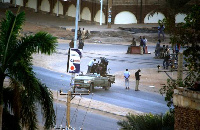 Members of Sudan's intelligence services were pictured shooting bullets in the air