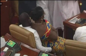 Ursula Owusu was captured sitting on the laps of Mr Akandoh during a tussle over a seat