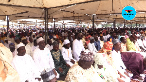 A photo of Muslims praying at the Black Star Square