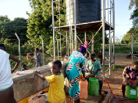 Residents of Canteen in Damongo fetching water from the community borehole