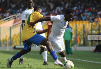 Joseph Paintsil beats his marker from Gabon to the ball