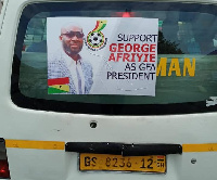 A commercial car with George Afriyie's poster