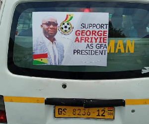 A commercial car with George Afriyie's poster