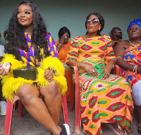 Jackie seated with her mother at her birthday durbar