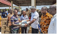 The MCE Abdul Issah donating streetlights to combat crime in the area