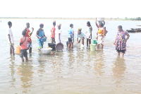 Residents fetching water from the dam